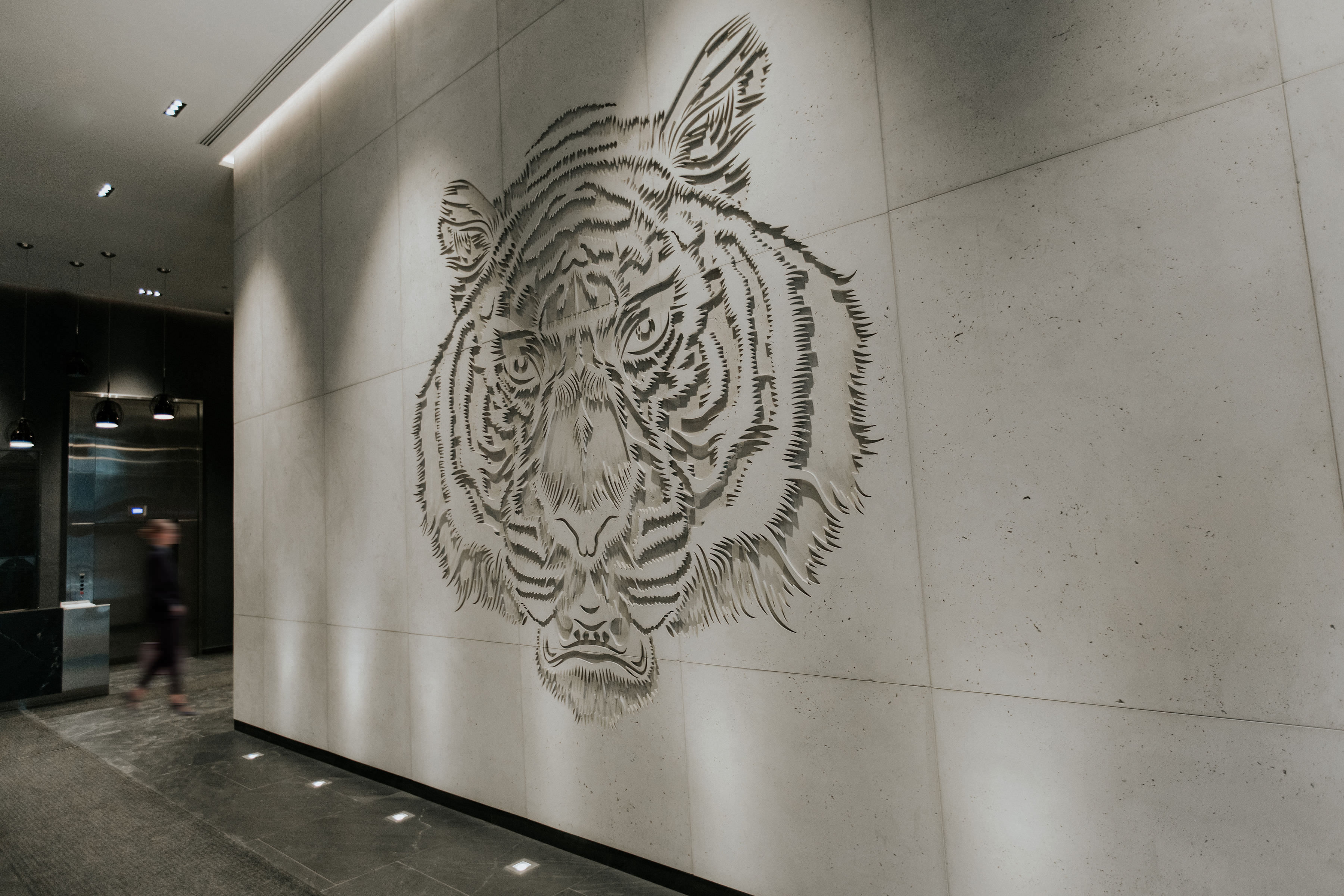 Tiger's face crafted on wall
